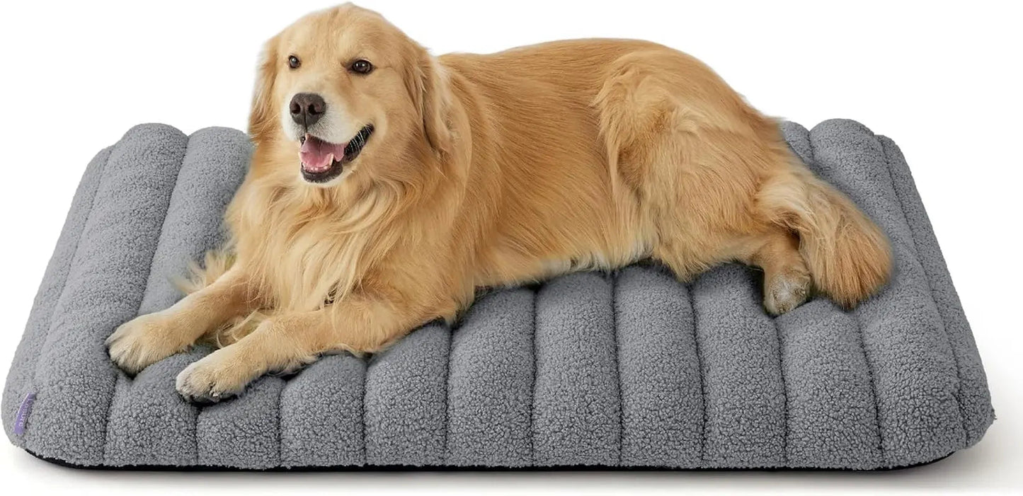 Orthopedic dog bed, dark gray plush with curved bolsters and quilted center