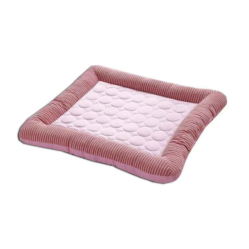 Pink cooling pet mat with pale dotted surface and gray-striped fabric border.