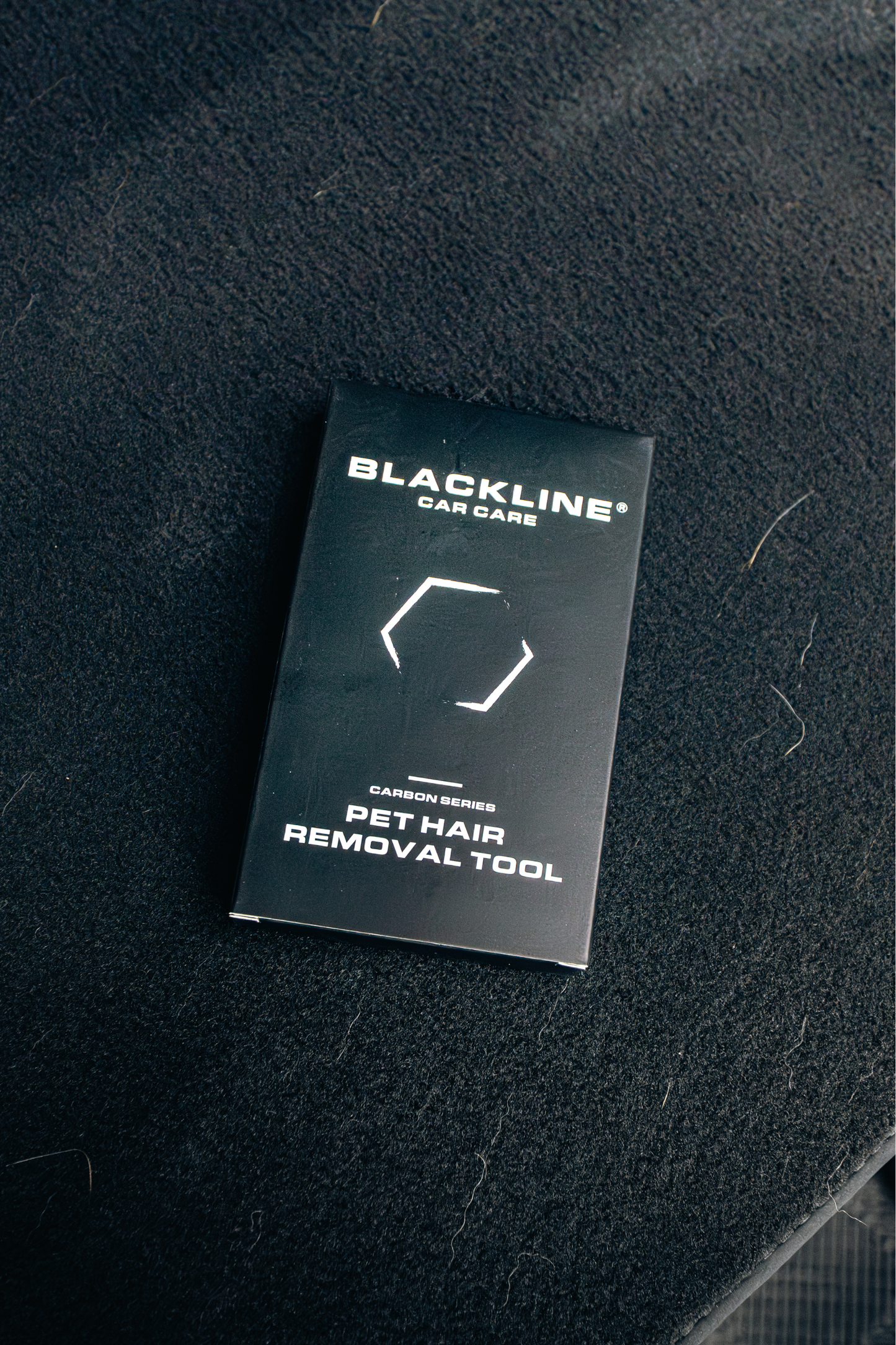 BlackLine pet hair removal tool box on grooming surface