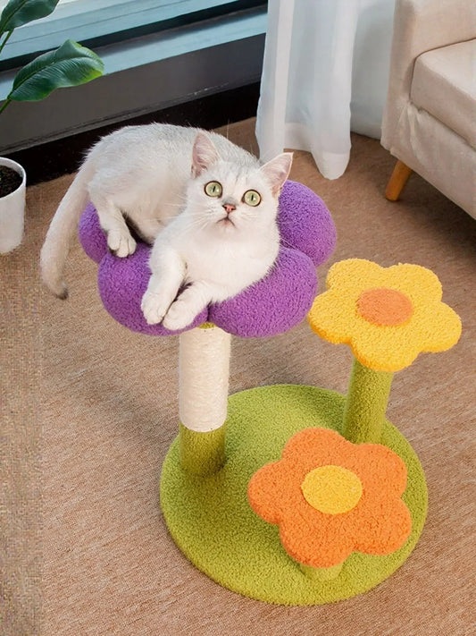 Flower-shaped plush cat tree scratching post with purple petals, green base, and cat