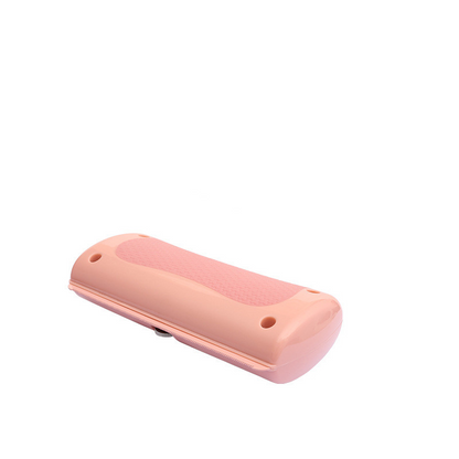 Pink pet grooming comb with textured grip and rounded end caps