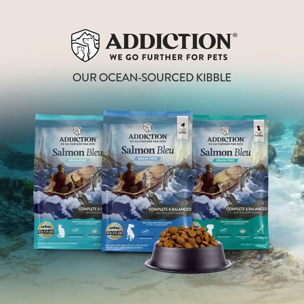 Salmon Bleu dry cat food ocean-sourced kibble with three bags and a kibble bowl