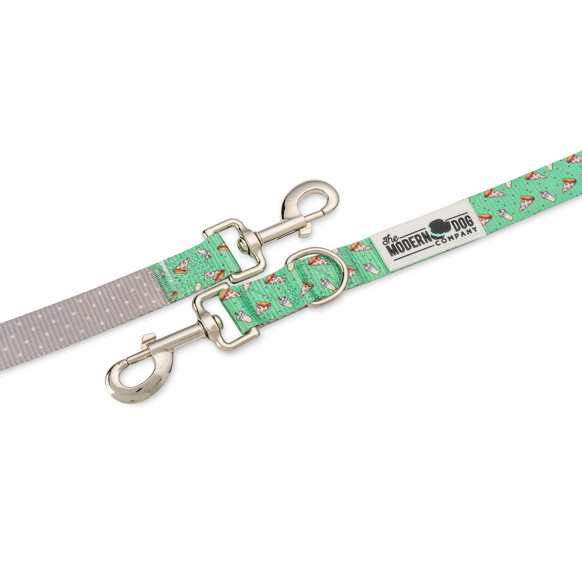 Green pizza-pattern dog leash close-up with two silver spring clips and label