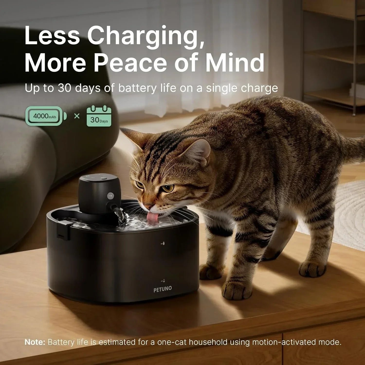 Tabby cat drinking from black PETUNO automatic water fountain with 4000mAh battery, ideal for pet hydration.