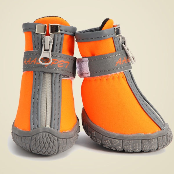 Waterproof pet rain boots, orange with gray trim and buckles on the side.