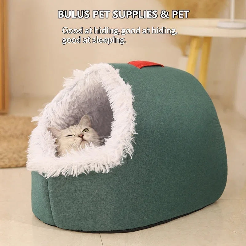 A grey cat resting inside a Pet Zen enclosed winter cat bed with green fabric and white faux fur.