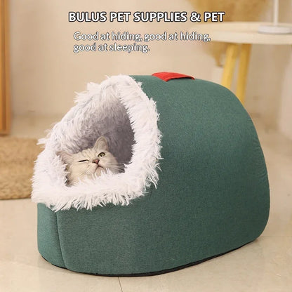 A grey cat resting inside a Pet Zen enclosed winter cat bed with green fabric and white faux fur.