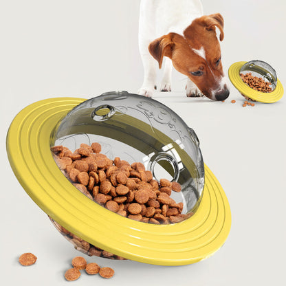 Yellow interactive dog treat toy with clear dome holding kibble and ridged rim