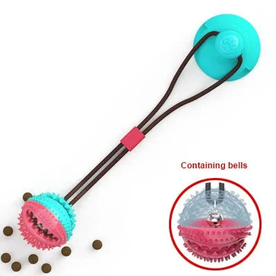 Interactive dog toy with treat-dispensing ball, suction cup base, and bells for mental stimulation and play