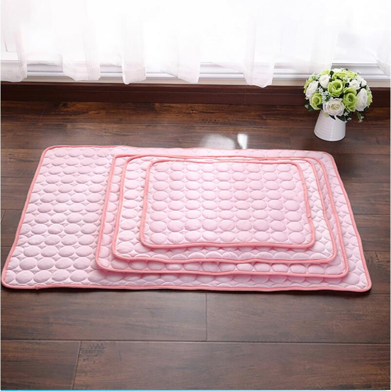 Pink pet cooling pad flat view with bubble quilting and double-row edging