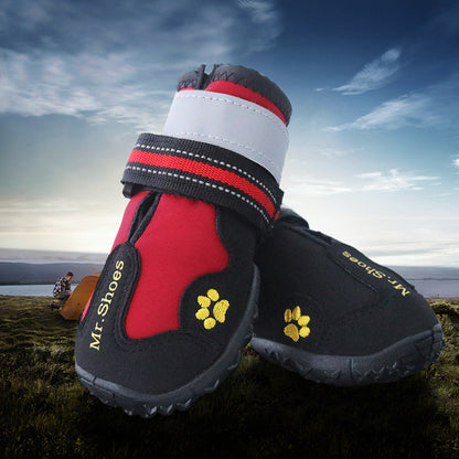Waterproof dog boots, black and red with white cuffs and yellow paw-print details