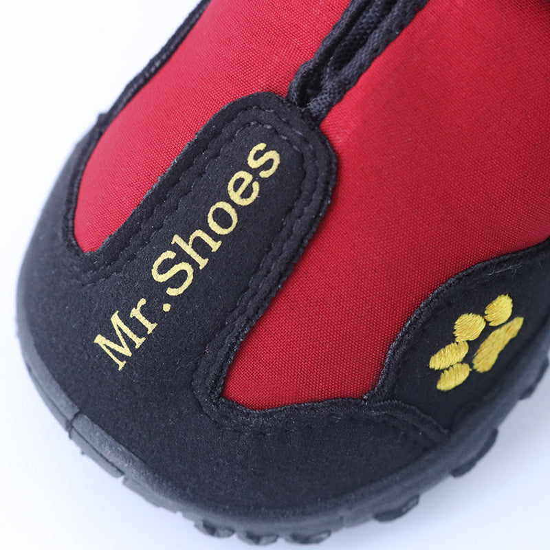 Waterproof dog boots in red with black trim, Mr. Shoes logo patch and paw print.