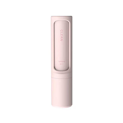 Pink lint roller brush device with textured roller head