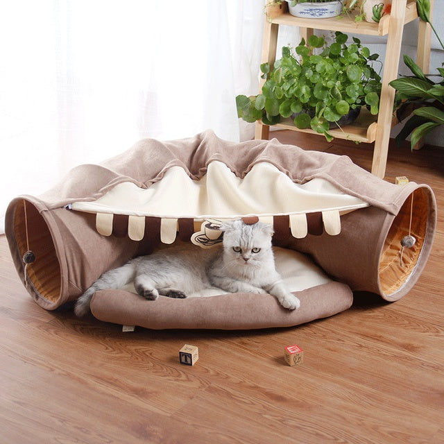 Collapsible cat tunnel play bed in taupe/brown with striped opening and padded cushion
