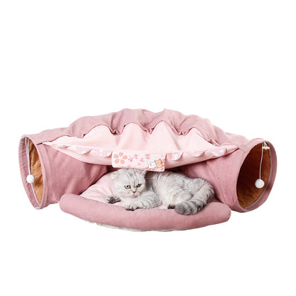 Collapsible cat tunnel play bed in pink with padded center and round side openings
