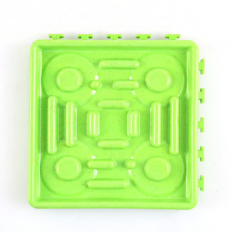 Green slow feeder licking mat with suction-style side tabs and raised peanut ridges