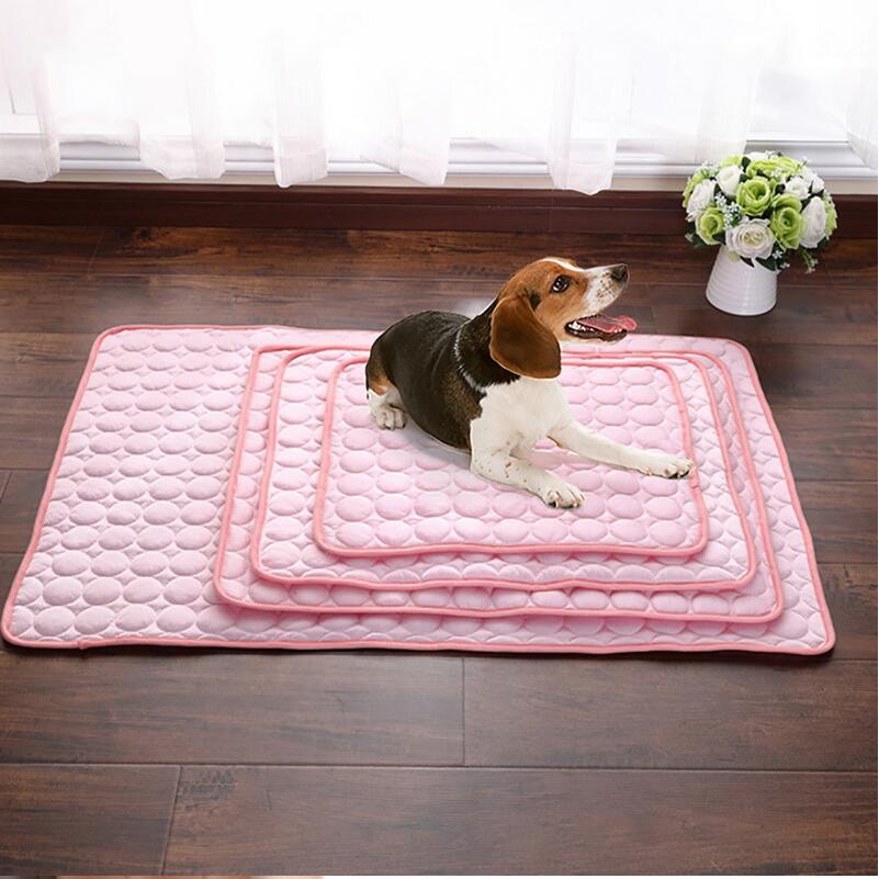 Pink pet cooling pad with raised bubble quilting and stitched inner border
