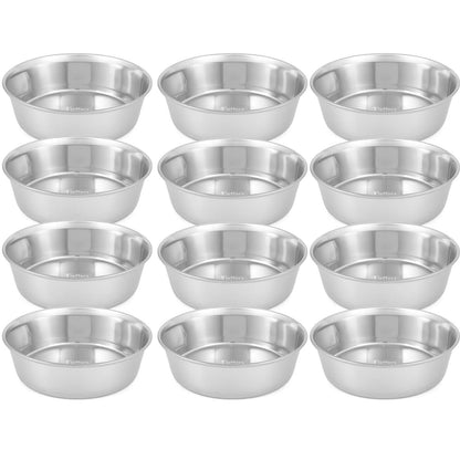 Group of stainless steel pet bowls arranged in rows, reflective polished interiors.