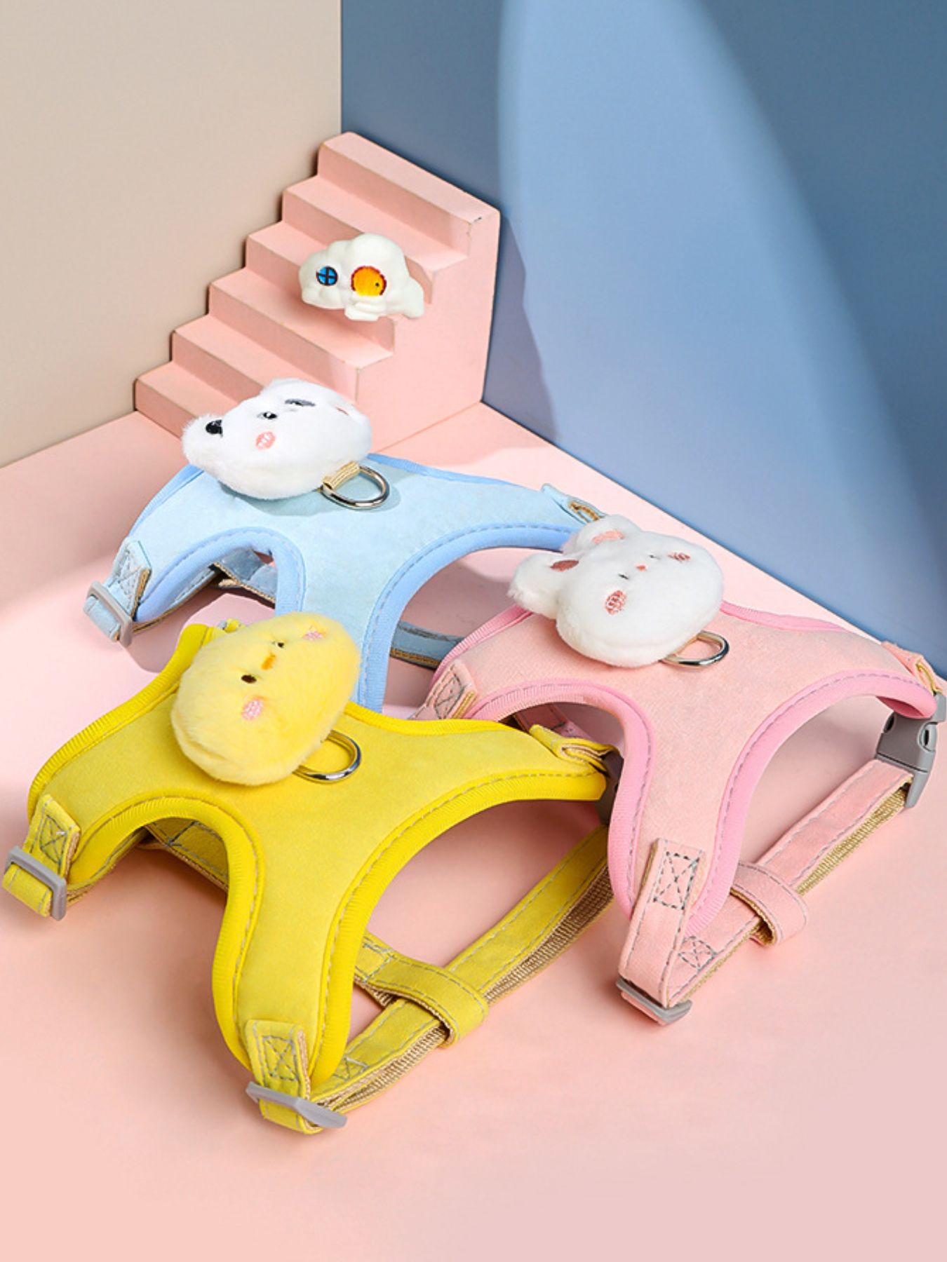 Pet harness set in pink, blue, and yellow with adjustable straps and D-rings