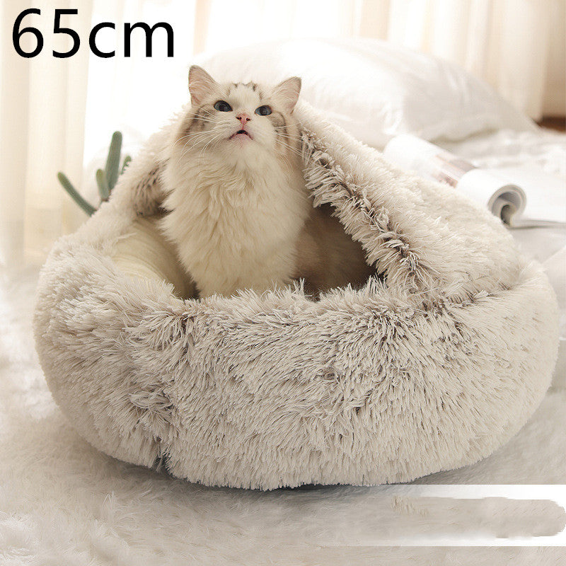 Cozy plush oval pet bed with grey shag exterior and light cushioned lining