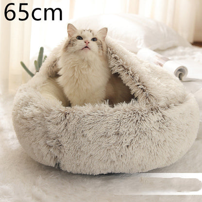 Cozy plush oval pet bed with grey shag exterior and light cushioned lining