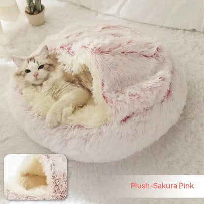 Pink-and-cream plush pet bed with U-shaped hood and fluffy sides