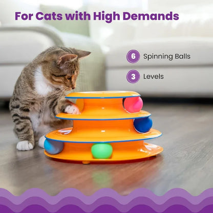 Brown tabby cat playing with WTN Essentials 3-tier interactive spinning ball track toy.