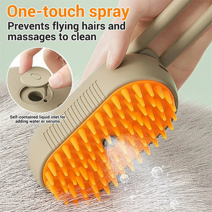 Beige electric cat spray massage brush with orange spiked comb head and control button