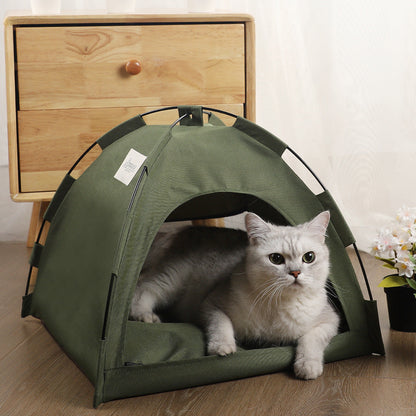Green pet tent bed with a gray cat resting inside on a cushion