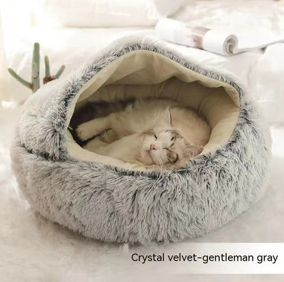 Gray plush pet bed with wide U-shaped opening and resting cat inside