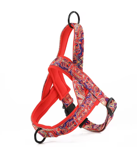 Red and orange patterned dog harness with black buckles and D-ring, no leash