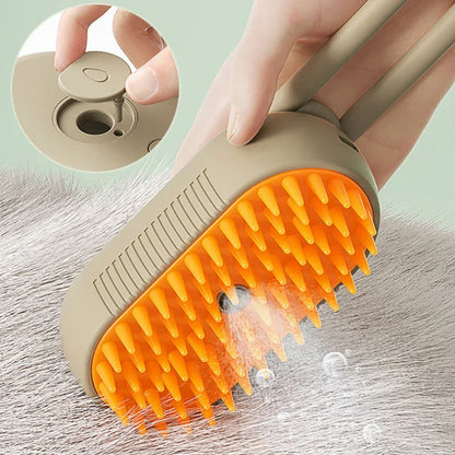 Beige electric cat spray massage comb with orange spiked comb head on gray fur