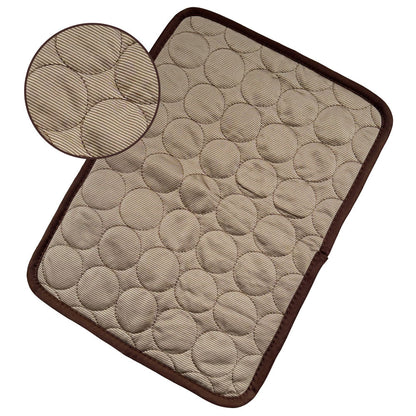 Beige cooling pet mat with textured honeycomb surface and dark brown border