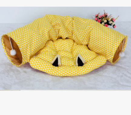 Yellow geometric fabric cat tunnel bed with cushioned center and side entrance hole