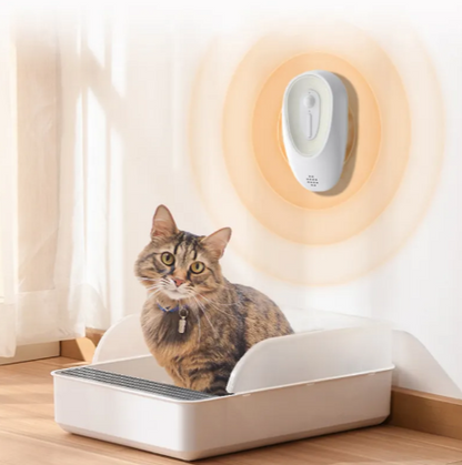 Litter box odor eliminator unit, white oval wall device with button and speaker holes