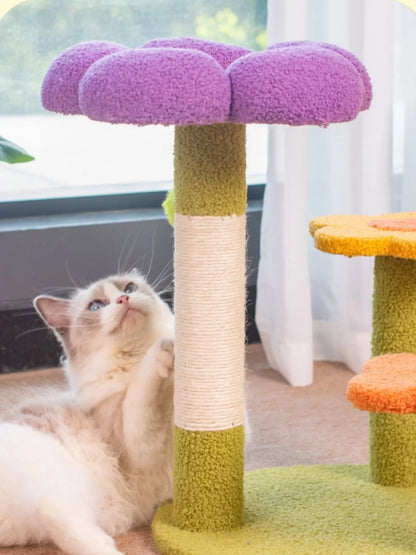 Purple flower top cat perch with beige scratching post and fluffy kitten resting