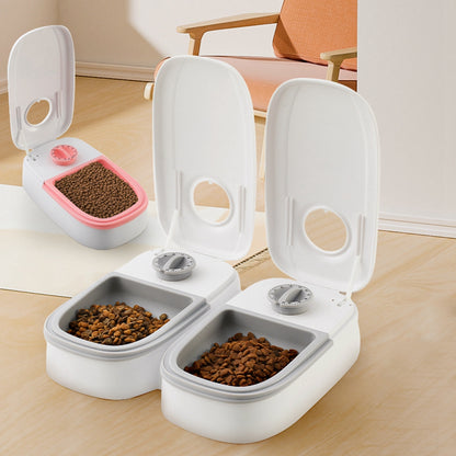 Pet feeder with open lid and two white compartments, showing two bowl portions