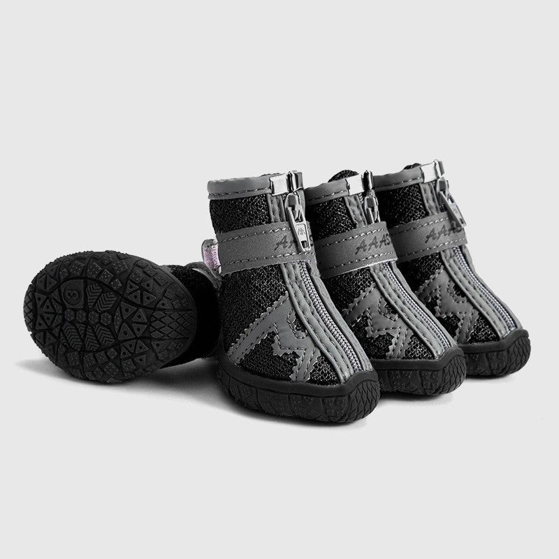 Waterproof pet rain boots, black with gray straps and textured tread outsole.