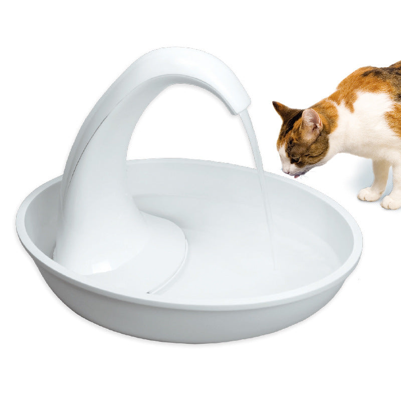 White automatic pet water dispenser bowl with curved spout, orange-and-white cat drinking