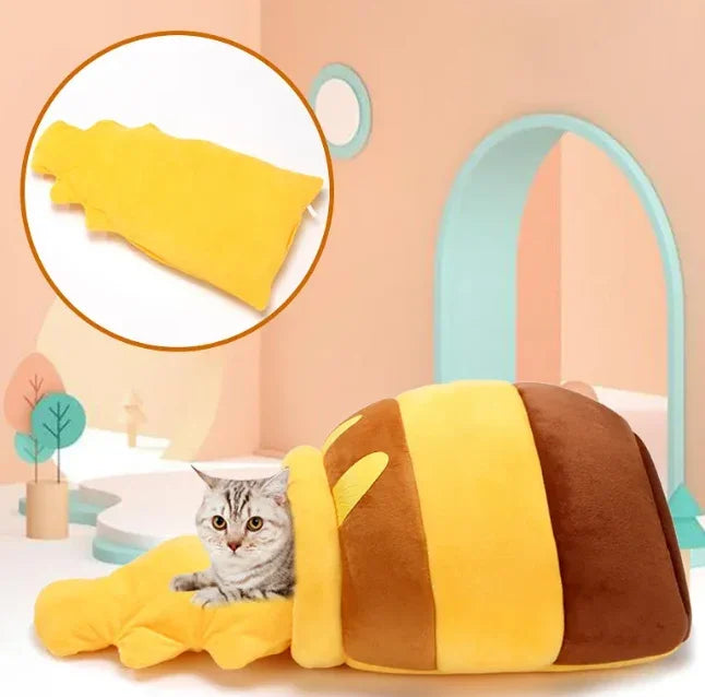 Adorable cat in cozy bee-shaped pet bed with soft yellow blanket, perfect for pampered pets