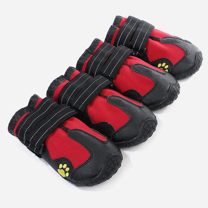 Red waterproof dog boots with paw-print logos and hook-and-loop straps