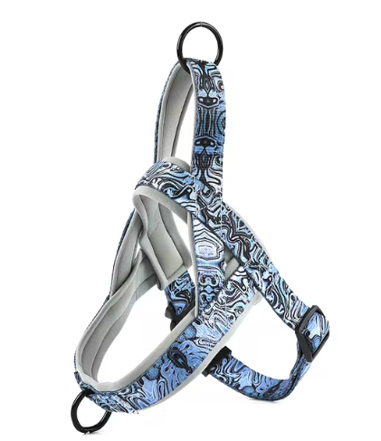 Dog harness in blue and white patterned fabric with black straps and metal ring