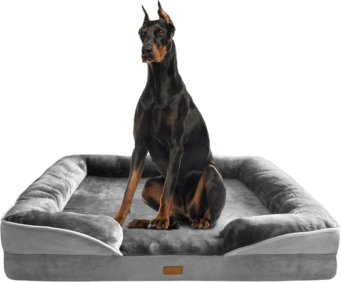 Grey orthopedic dog bed sofa with rounded side bolsters and cushioned center