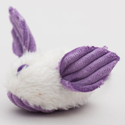 Close-up of purple and white plush dust bunny cat toy with ridged ears