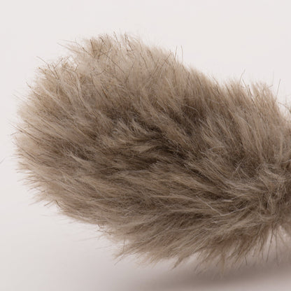 Brown plush squirrel tail section with shaggy fur