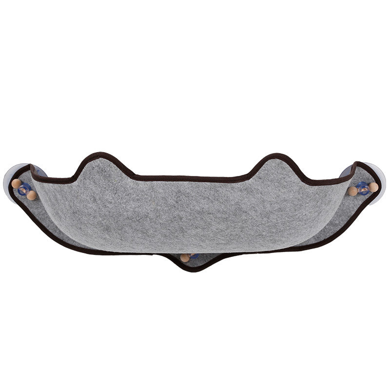 Grey window cat hammock with dark trim and four suction cups