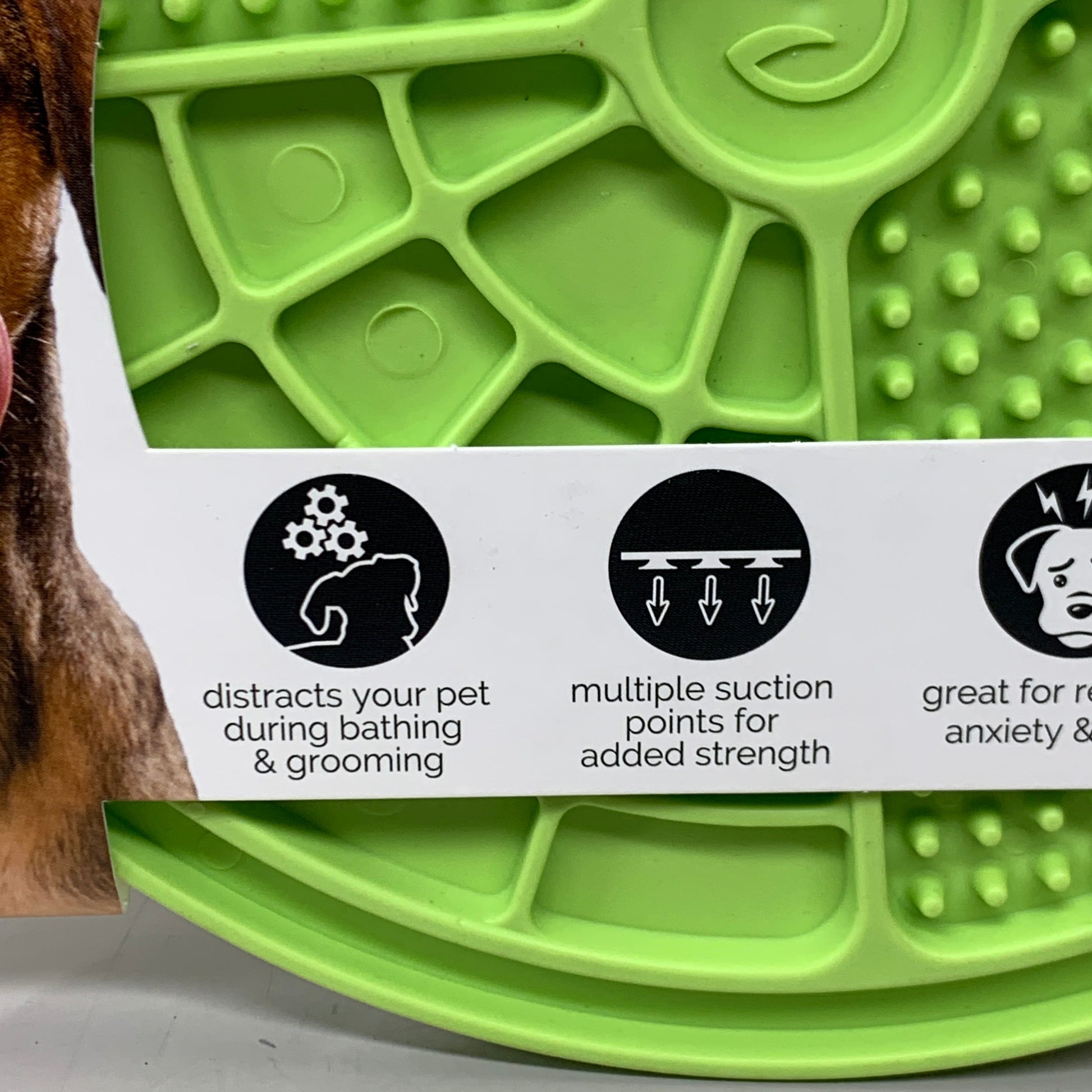 Green slow feeder licking mat surface with ridges and suction-cup features
