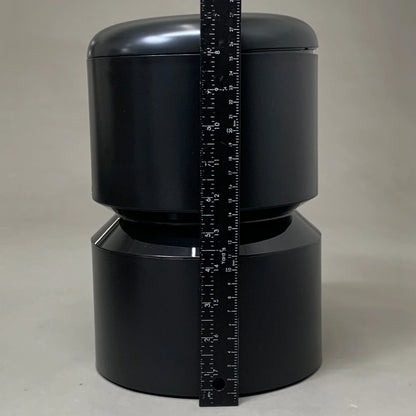 Black automatic cat feeder body with measuring tape vertically