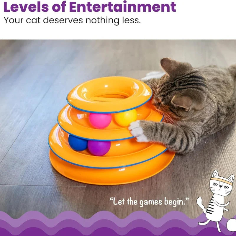 A tabby cat playing with a WTN Essentials 3-tier orange interactive spinning ball track toy.