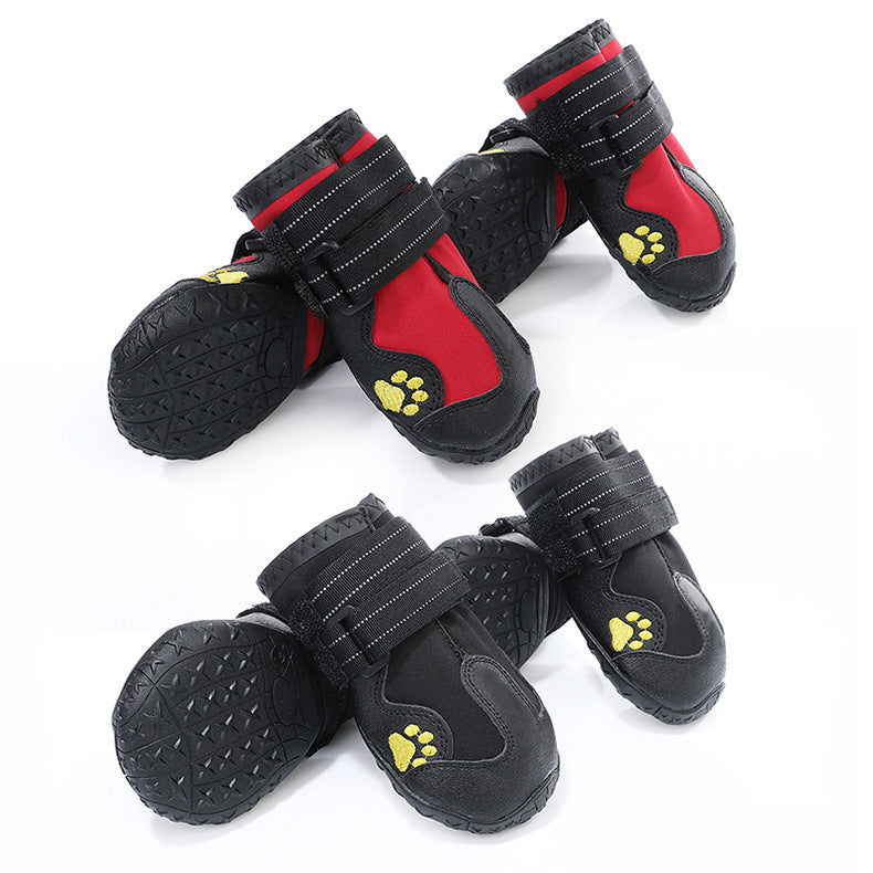 Set of red and black waterproof dog boots with paw-print patches and hook-and-loop straps